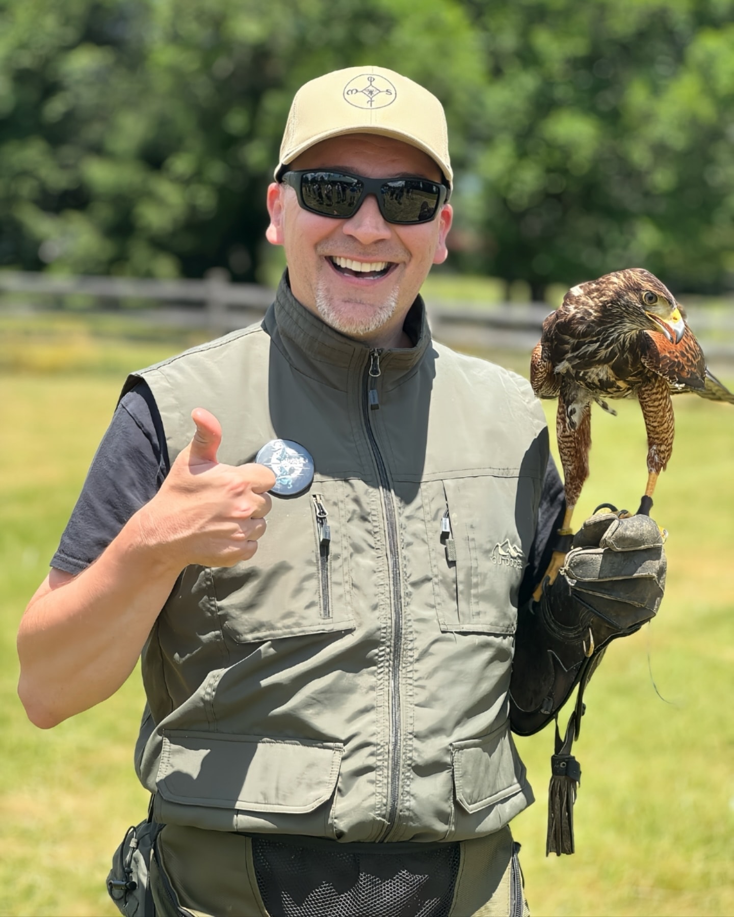 Gregory with Harris's hawk giving thumbs up